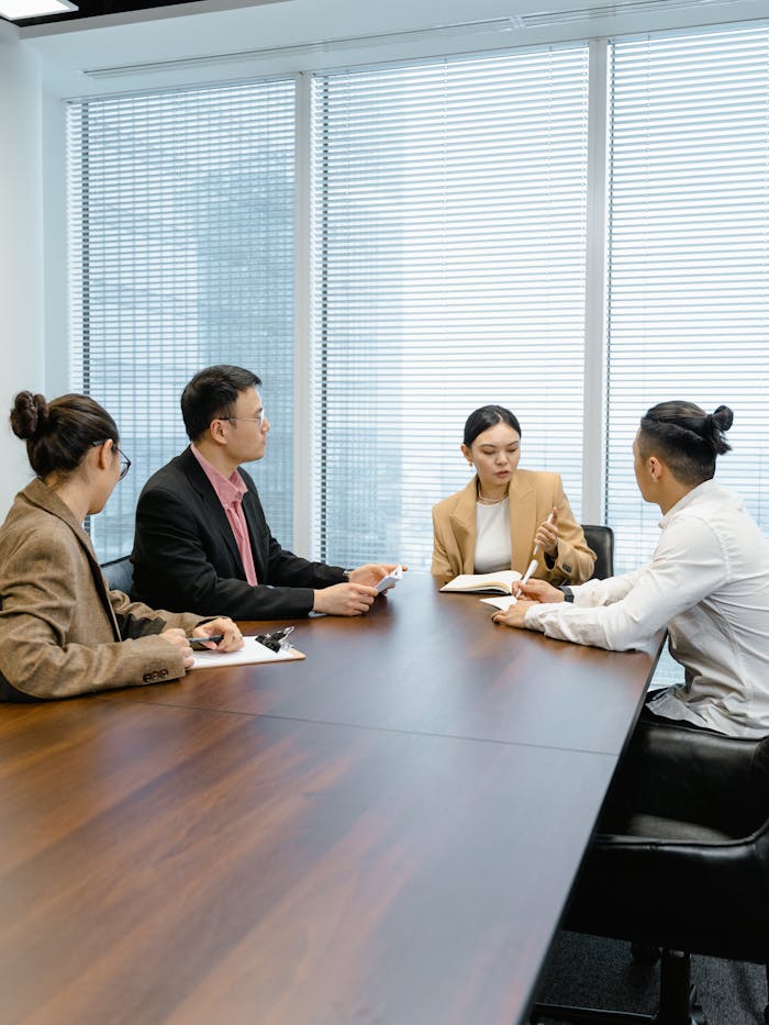 why-choose-us Group of colleagues collaborating in a modern office setting.